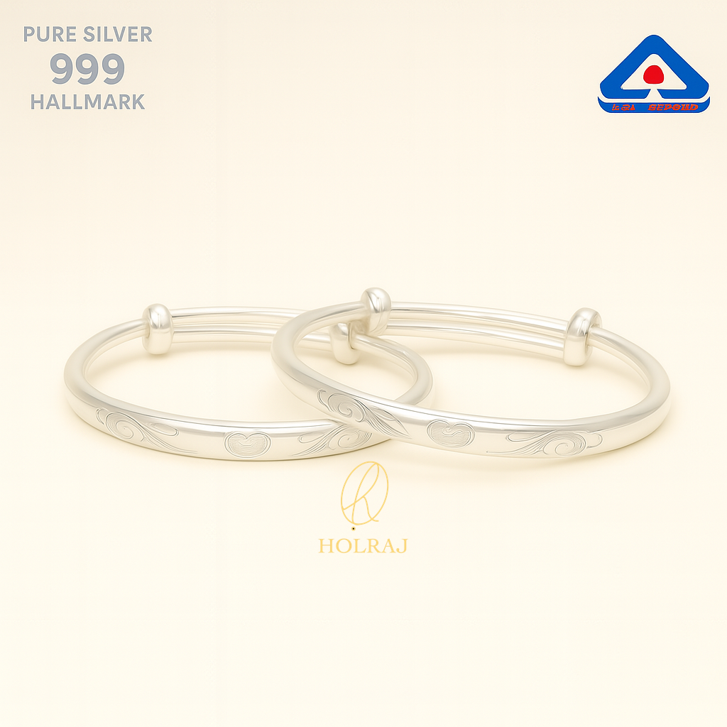 A pair of Pure 999 Silver adjustable baby bangles with embossed floral designs from Holraj