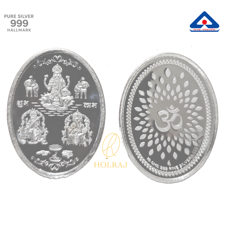 999 silver oval coin featuring Goddess Lakshmi and Lord Ganesha on one side, and Om symbol with lotus design on the reverse.