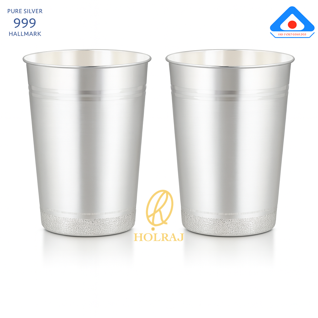 A pair of handcrafted 999 silver lassi glass with flared rim, 5-inch height and 4-inch mouth, displayed with BIS hallmark and Holraj branding.
