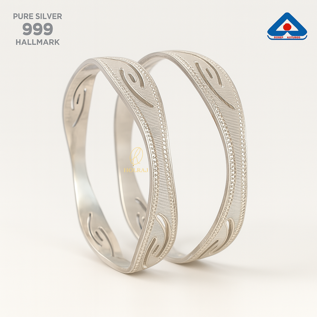 Pair of Pure 999 Silver bangles with minimalist S-curve engravings and beaded edges, photographed on a white background with BIS Hallmark - by HOLRAJ.