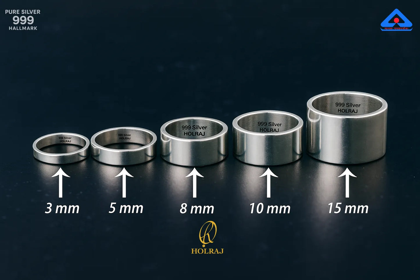Set of Holraj Branded 999 purity silver rings with size indicators on a dark background placed flat on a dark surface.