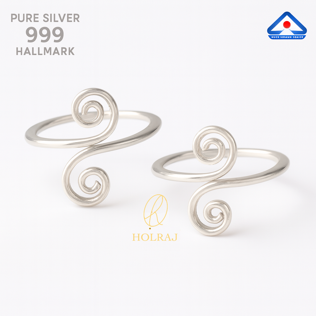 Pair of pure 999 silver toe rings with spiral design worn on both feet.