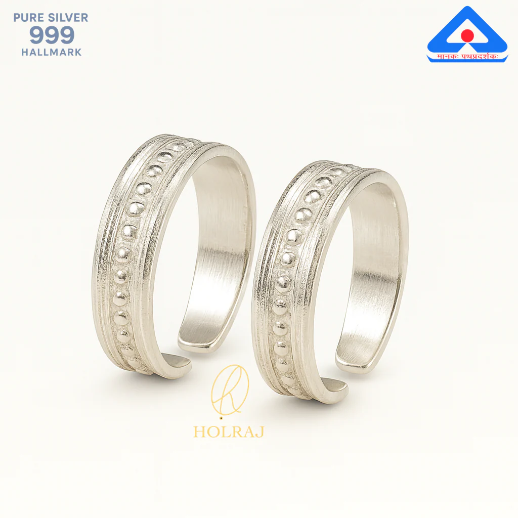 Pair of heritage-inspired silver toe rings with dotted ridge and oxidized finish by Holraj