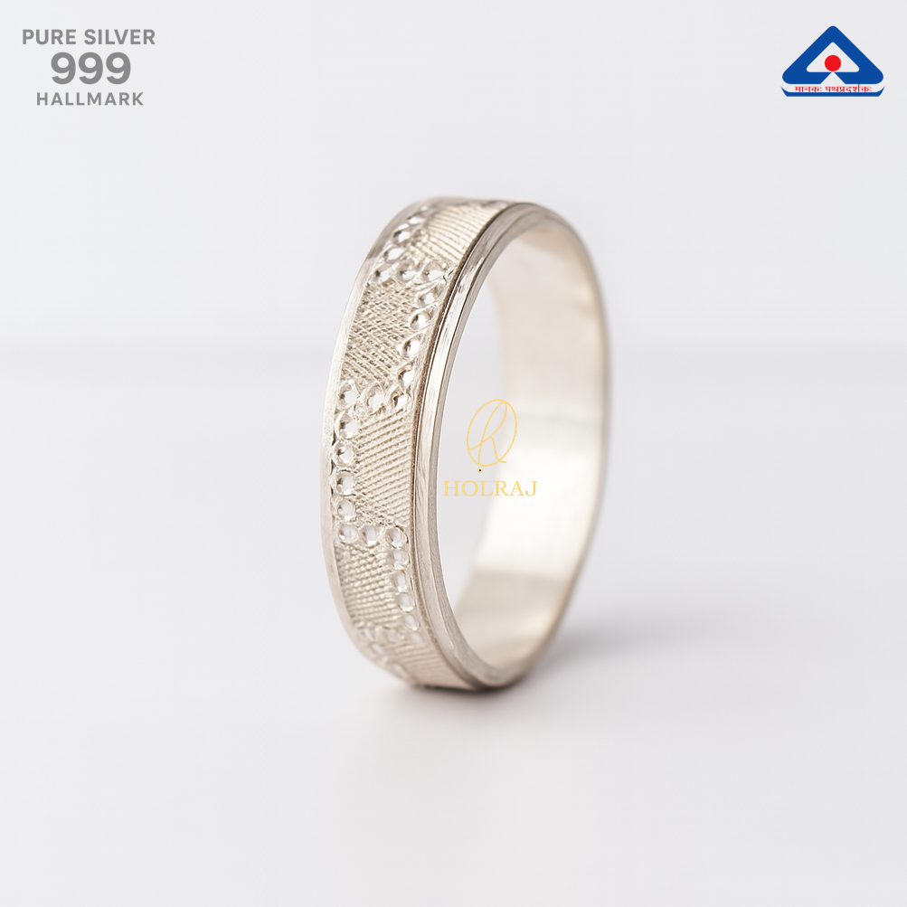 A handcrafted textured pure silver ring band named RajNaksh by Holraj, displayed on a white background