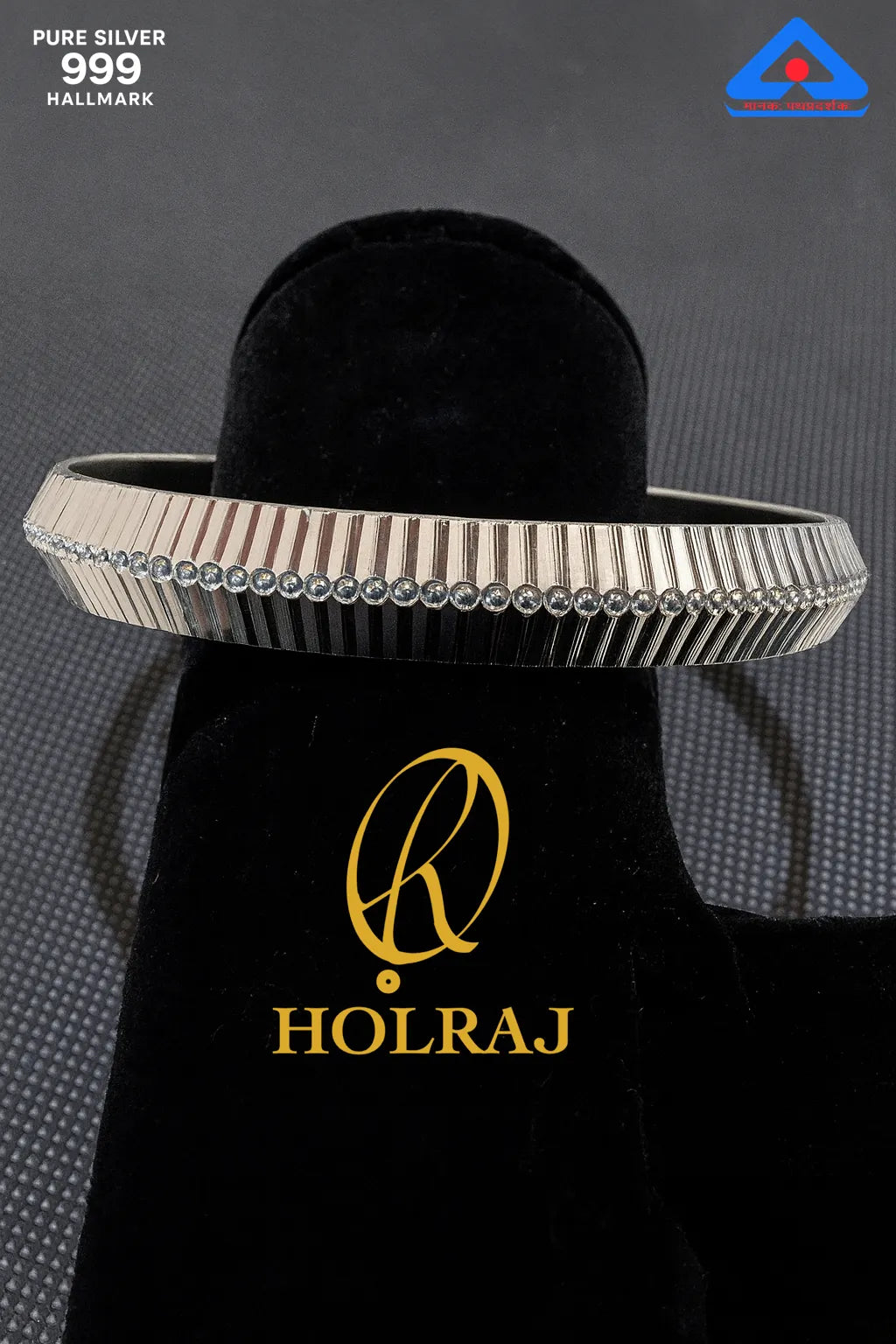 Hallmark certified RajRidhi 999 silver kada by Holraj with dotted central engraving – angled view