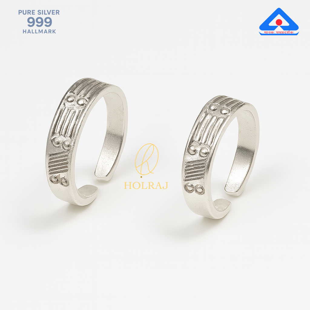 Pair of RajVrit toe rings in 999 silver with embossed geometric design by Holraj