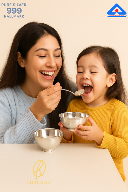 Woman feeding a child from BIS Hallmarked pure 999 silver bowls by HolRaj