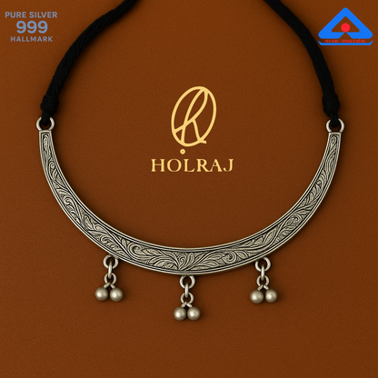 Chandrika Hansuli floral engraved pure 999 silver necklace with ghungroos and black adjustable thread by Holraj.