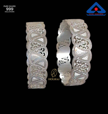 Two silver bangles in BIS Hallmark pure 999 silver with intricate designs on a black background, featuring the brand 'HOLRAJ'.