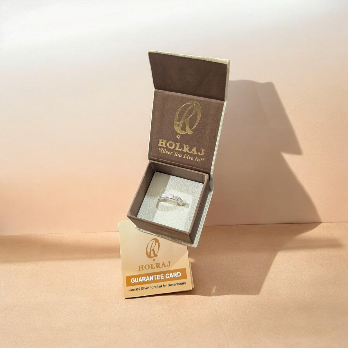 Holraj Ring Box Packing with Guarantee card certifying and assuring the fineness of Silver used in the mentioned article.