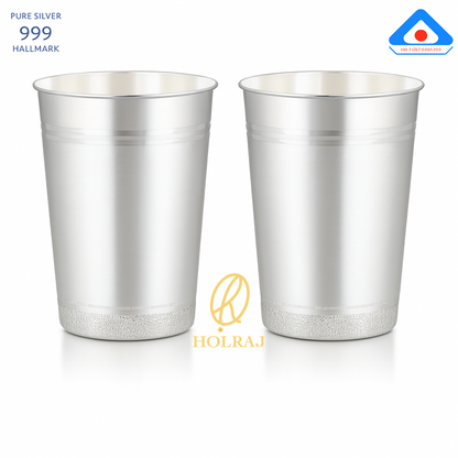A pair of handcrafted 999 silver lassi glass with flared rim, 5-inch height and 4-inch mouth, displayed with BIS hallmark and Holraj branding.