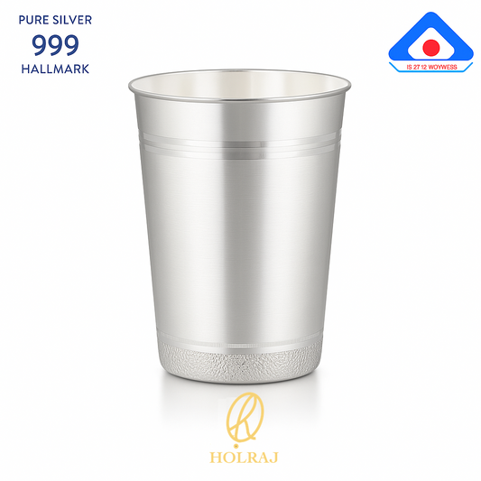 A handcrafted 999 silver lassi glass with a flared rim, 5-inch height and 4-inch mouth, displayed with BIS hallmark and Holraj branding.