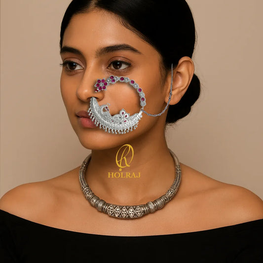 Woman wearing HOLRAJ branded 999 pure silver Morni nose ring / Nath and hansuli.