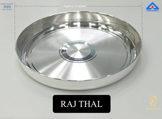 A 6-inch round thali crafted from 999 pure silver with a brushed finish and concentric etchings, certified with BIS hallmark by Holraj.