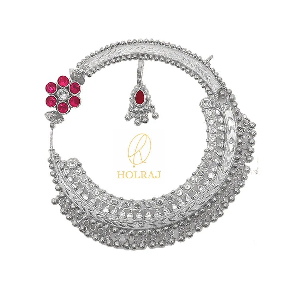 Holraj branded intricately handcrafted Pahadi Nath or Nathuli or Nosering in BIS Hallmarked 999 pure silver, with red gemstones on a white background inspired by Uttarakhand’s bridal jewelry.