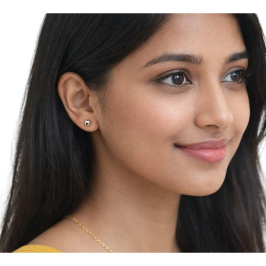 Indian woman wearing ShuddhBindu minimalist 999 pure silver ball stud earrings by Holraj