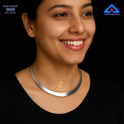 Shuddh Hansuli Grace – A smiling woman wearing 999 pure silver minimalist choker necklace with high-polish finish by Holraj.